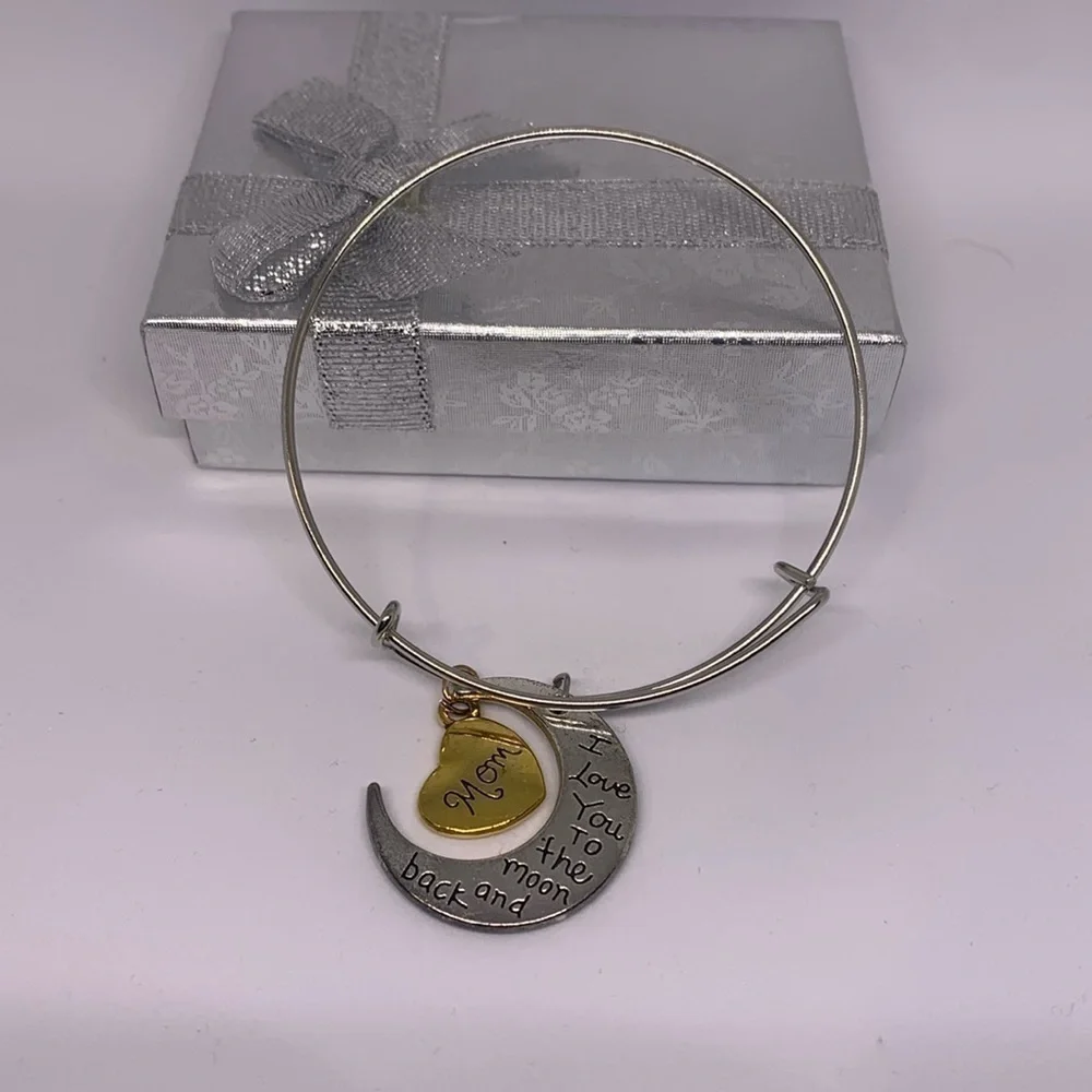 Gold and silver tone mom bracelet.